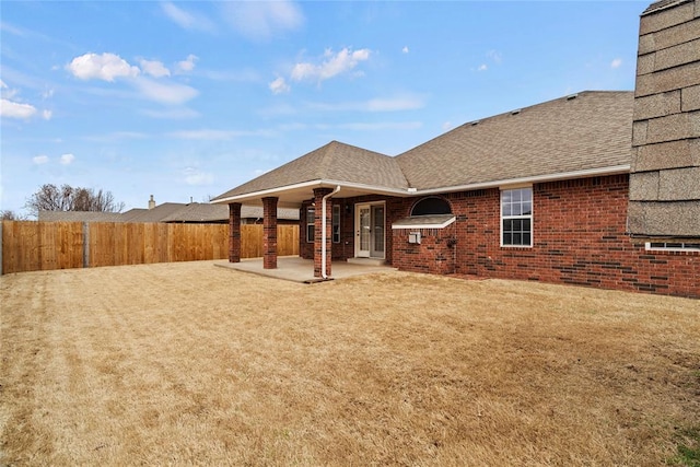 exterior space featuring a patio area and fence