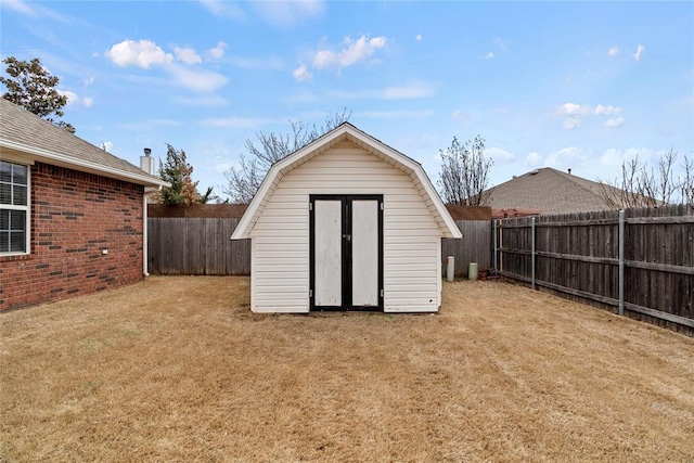 view of shed with a fenced backyard