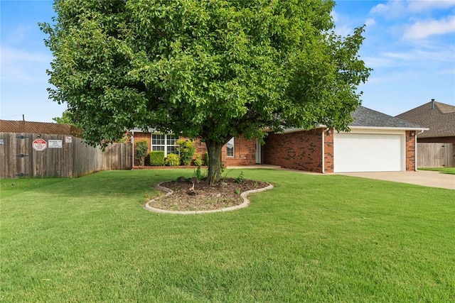 501 N Cherokee Way, Mustang, OK 73064 - view of property hidden behind natural elements with a garage, brick siding, and driveway