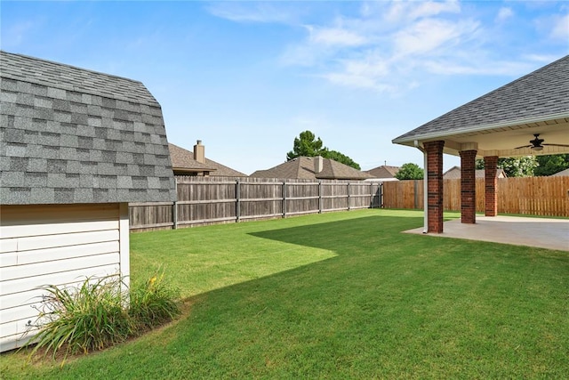 501 N Cherokee Way, Mustang, OK 73064 - fenced backyard with a patio area and ceiling fan