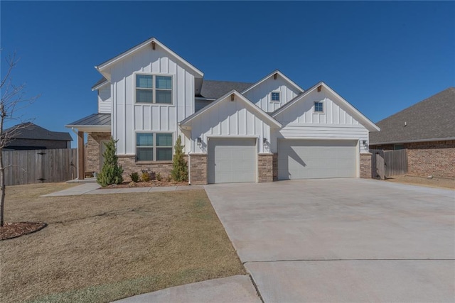 view of front of house featuring board and batten siding, brick siding, driveway, and a garage