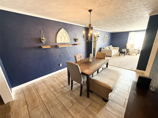 dining space featuring an inviting chandelier, crown molding, baseboards, and a textured ceiling