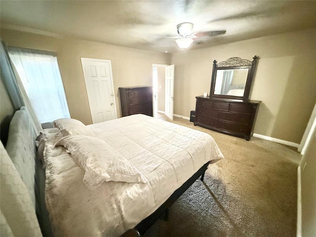 bedroom featuring light carpet, ceiling fan, and baseboards