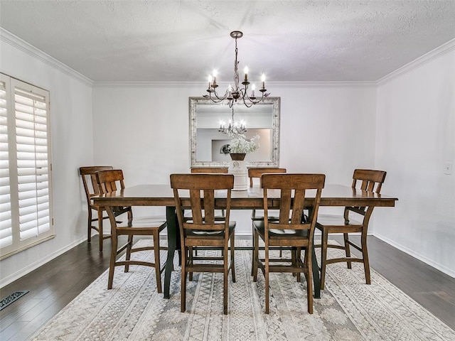 dining room featuring a wealth of natural light, ornamental molding, and wood finished floors