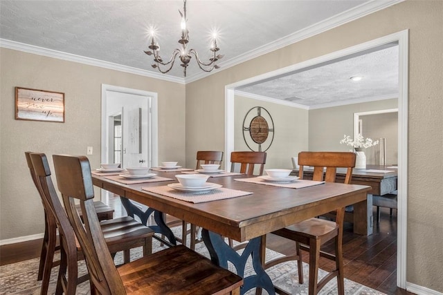 dining area with ornamental molding, baseboards, wood-type flooring, and a chandelier