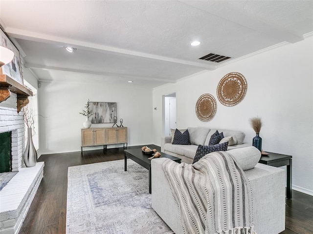 2900 Wilton Ln, Oklahoma City, OK 73120 - living room featuring beamed ceiling, hardwood / wood-style floors, a fireplace, recessed lighting, and baseboards