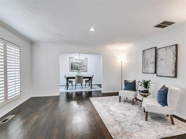 2900 Wilton Ln, Oklahoma City, OK 73120 - living area featuring a chandelier, hardwood / wood-style floors, baseboards, ornamental molding, and recessed lighting
