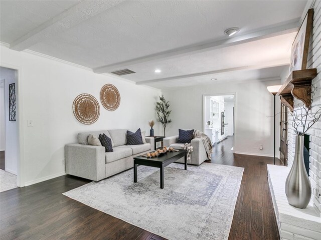 2900 Wilton Ln, Oklahoma City, OK 73120 - living area with beam ceiling, a brick fireplace, dark wood finished floors, baseboards, and recessed lighting