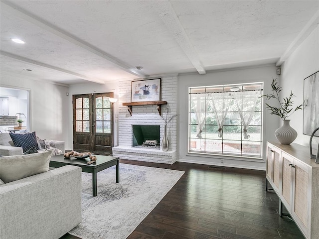 2900 Wilton Ln, Oklahoma City, OK 73120 - living area featuring beamed ceiling, french doors, dark wood-style flooring, a textured ceiling, and recessed lighting