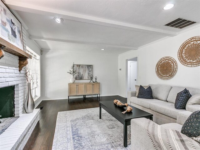 2900 Wilton Ln, Oklahoma City, OK 73120 - living area featuring beam ceiling, dark wood-style floors, a fireplace, recessed lighting, and baseboards