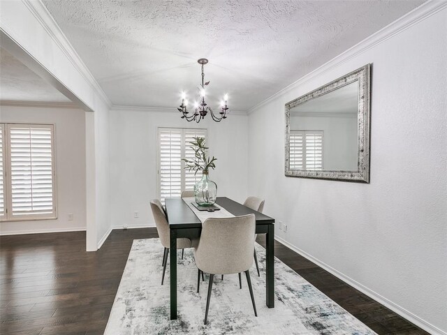 2900 Wilton Ln, Oklahoma City, OK 73120 - dining area featuring a chandelier, dark wood-style flooring, baseboards, a textured ceiling, and crown molding
