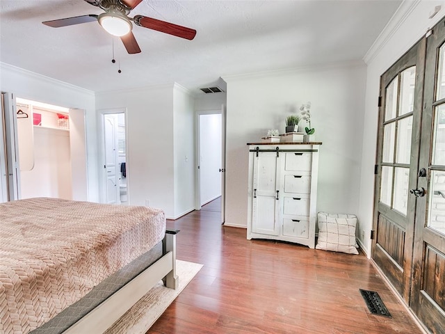 2900 Wilton Ln, Oklahoma City, OK 73120 - bedroom featuring crown molding, wood finished floors, baseboards, and ceiling fan
