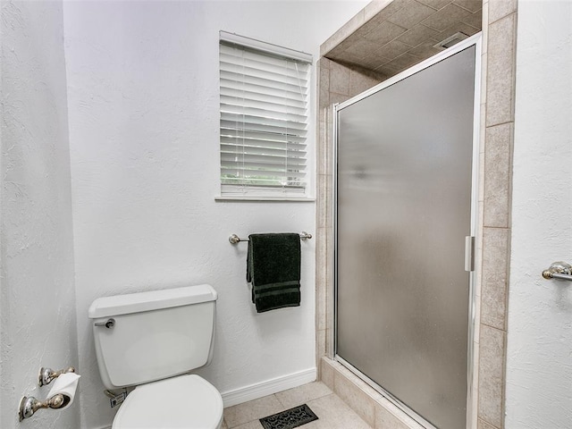 2900 Wilton Ln, Oklahoma City, OK 73120 - full bathroom with a stall shower, toilet, tile patterned floors, and baseboards