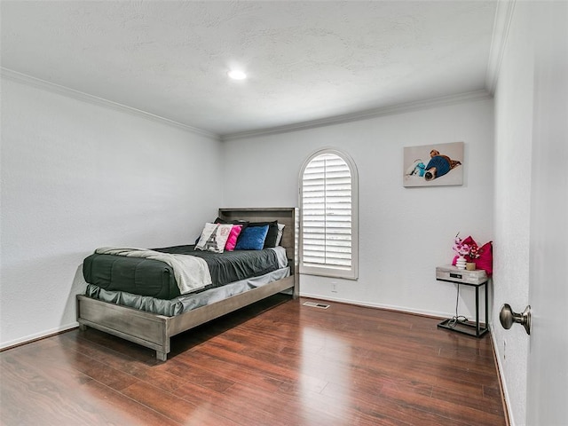 2900 Wilton Ln, Oklahoma City, OK 73120 - bedroom with wood finished floors, crown molding, and baseboards