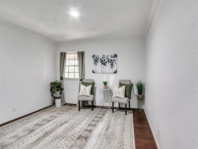 2900 Wilton Ln, Oklahoma City, OK 73120 - sitting room featuring ornamental molding, wood finished floors, and baseboards