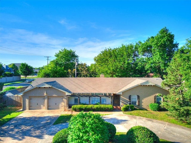 2900 Wilton Ln, Oklahoma City, OK 73120 - single story home with a garage, concrete driveway, fence, and a chimney