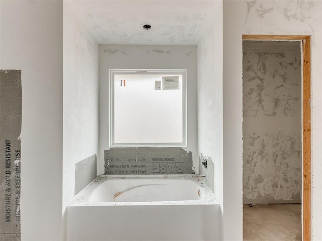 bathroom with a garden tub