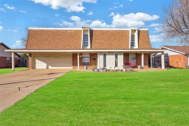 view of front property featuring mansard roof, a shingled roof, brick siding, driveway, and a front lawn