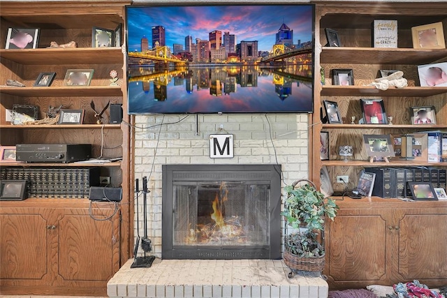 interior details with a brick fireplace