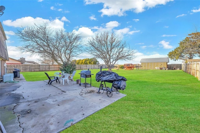 view of yard featuring a patio, central AC unit, a fenced backyard, an outdoor structure, and a storage unit