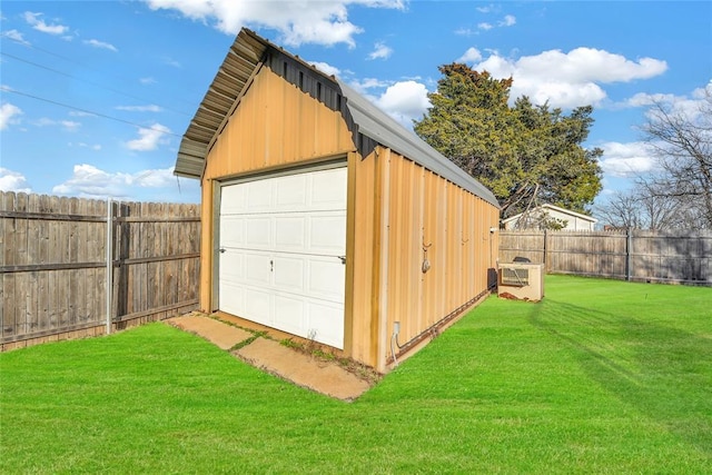 detached garage featuring fence