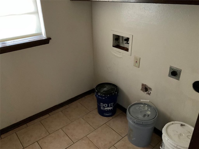 washroom featuring light tile patterned flooring, hookup for a washing machine, hookup for an electric dryer, laundry area, and baseboards