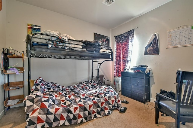 carpeted bedroom featuring visible vents and baseboards