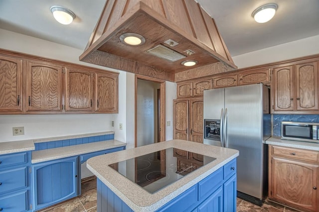 kitchen featuring blue cabinetry, island exhaust hood, stainless steel appliances, and light countertops