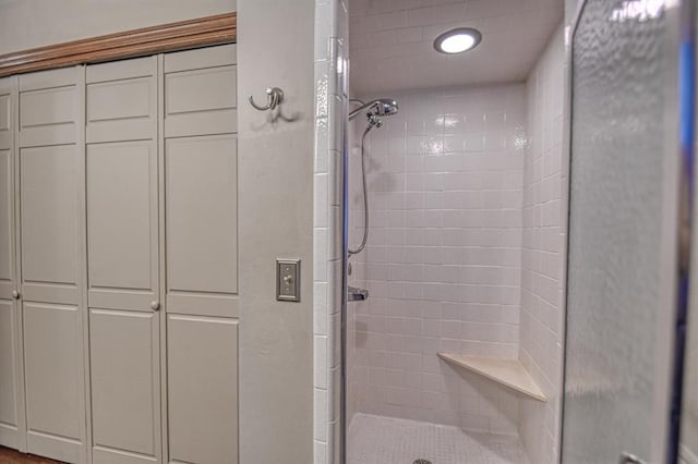 bathroom with a shower stall