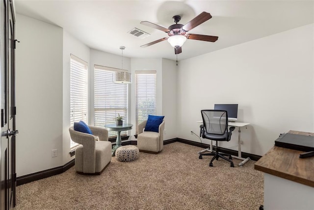 office area featuring baseboards, visible vents, ceiling fan, and carpet flooring