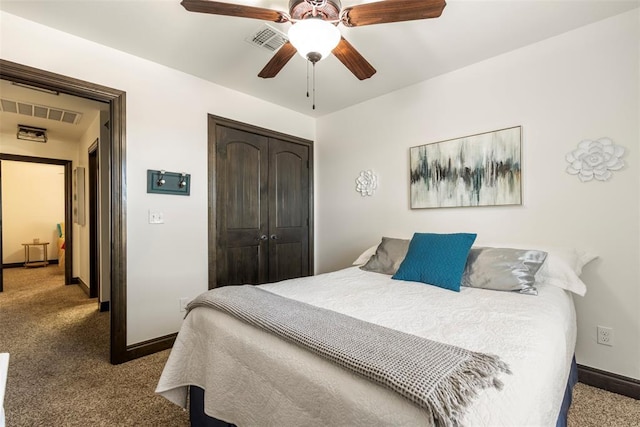 bedroom featuring a closet, carpet, visible vents, and baseboards