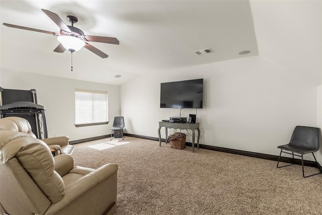 carpeted living room featuring ceiling fan, visible vents, and baseboards