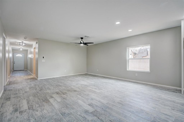 spare room with visible vents, baseboards, a ceiling fan, light wood-style floors, and recessed lighting