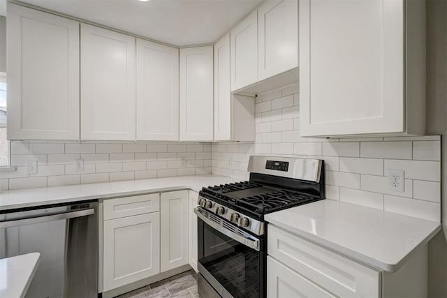 kitchen featuring appliances with stainless steel finishes, light countertops, and tasteful backsplash