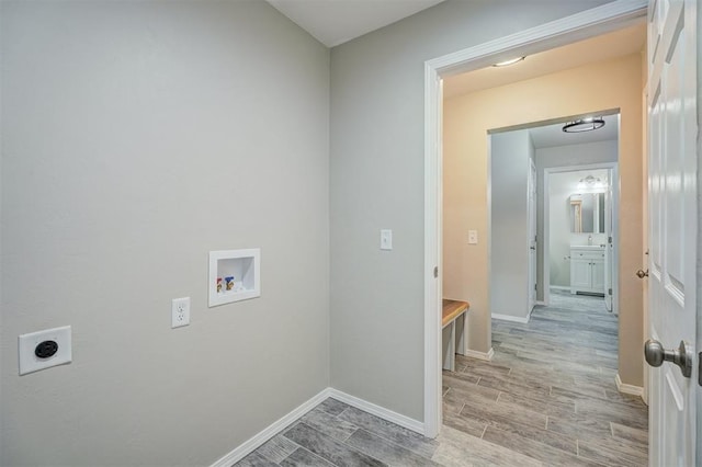 laundry room featuring laundry area, wood finish floors, washer hookup, baseboards, and electric dryer hookup