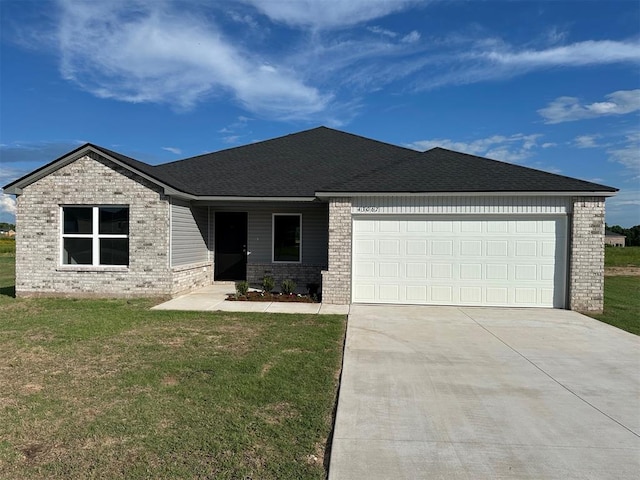 43067 Wagon Trl, Shawnee, OK 74804 - ranch-style home with brick siding, driveway, an attached garage, and a front lawn