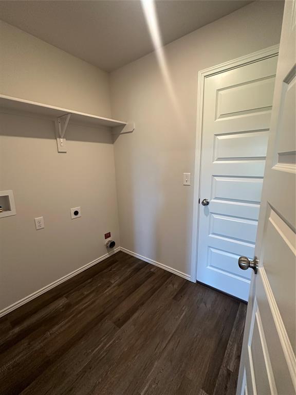 43067 Wagon Trl, Shawnee, OK 74804 - laundry area featuring electric dryer hookup, dark wood finished floors, and washer hookup