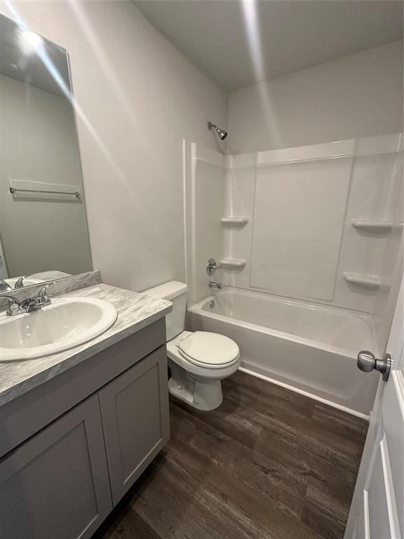 43067 Wagon Trl, Shawnee, OK 74804 - full bath with wood finished floors, vanity, and  shower combination