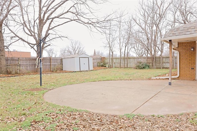 view of patio / terrace featuring an outbuilding, a fenced backyard, and a shed