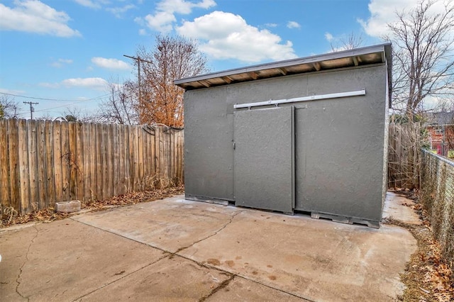 view of shed featuring a fenced backyard