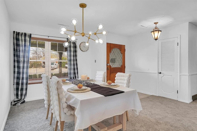 dining space featuring carpet flooring and baseboards