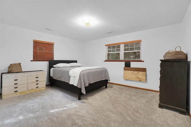 bedroom featuring carpet floors and baseboards