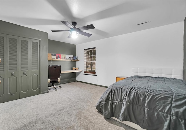 bedroom featuring carpet, a closet, visible vents, a ceiling fan, and baseboards