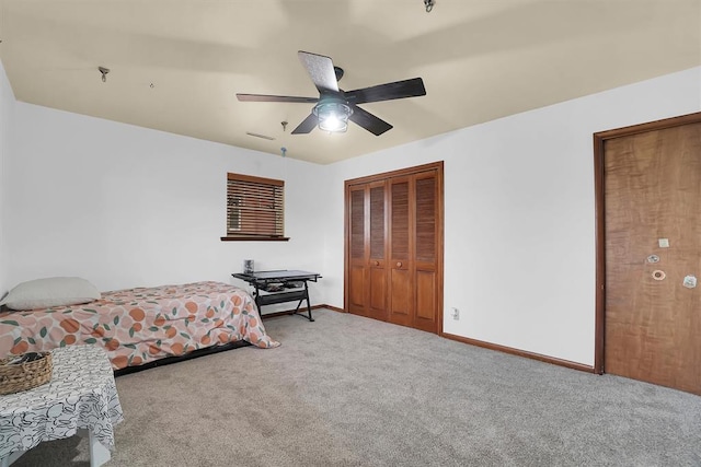 bedroom with ceiling fan, a closet, carpet, and baseboards