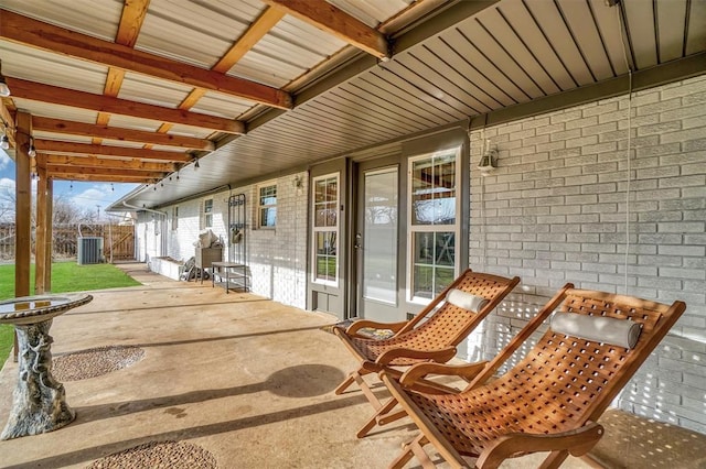 view of patio featuring fence and central AC