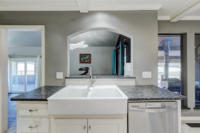 kitchen featuring white cabinets, dishwasher, a textured wall, ornamental molding, and a sink