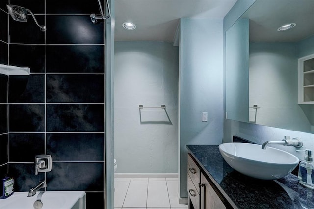 full bath featuring tile patterned flooring, toilet, recessed lighting, vanity, and a tub