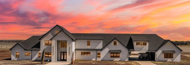 view of front of house featuring stucco siding