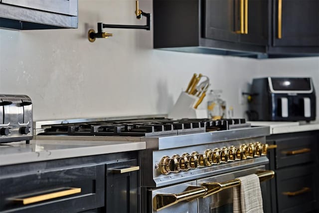 kitchen with light countertops and dark cabinetry