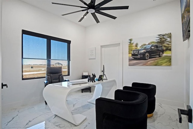 home office with ceiling fan, marble finish floor, and baseboards